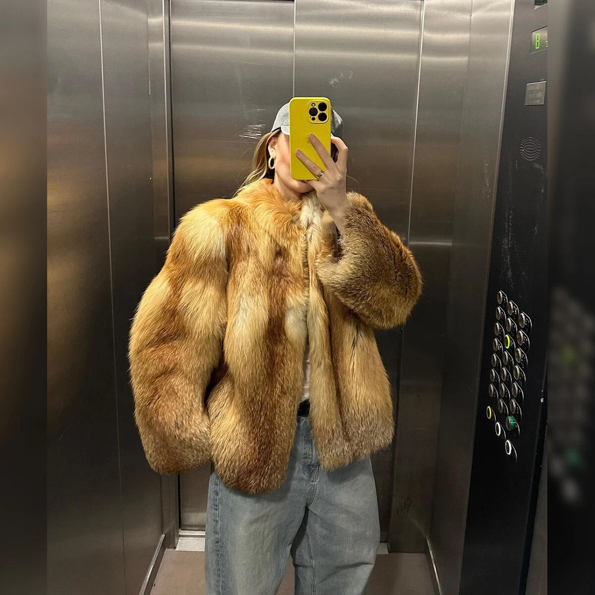 Manteau court en fausse fourrure